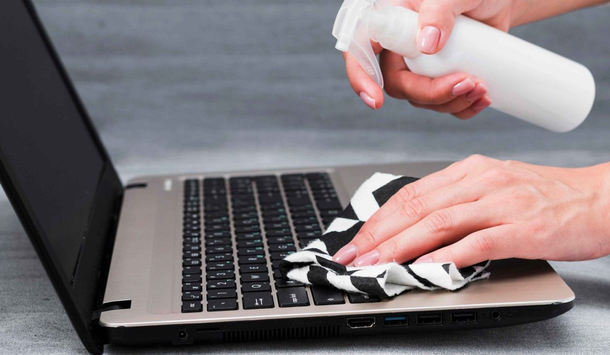 hands-disinfecting-laptop-keyboard_11zon